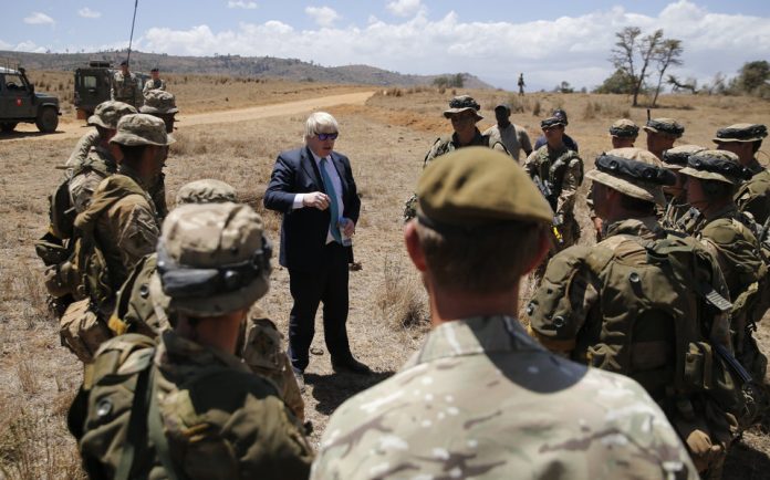 Britain's Foreign Secretary Boris Johnson talks to British soldiers at the British Army Training Unit Kenya (BATUK), in Ole Naishu near Nanyuki, in Kenya